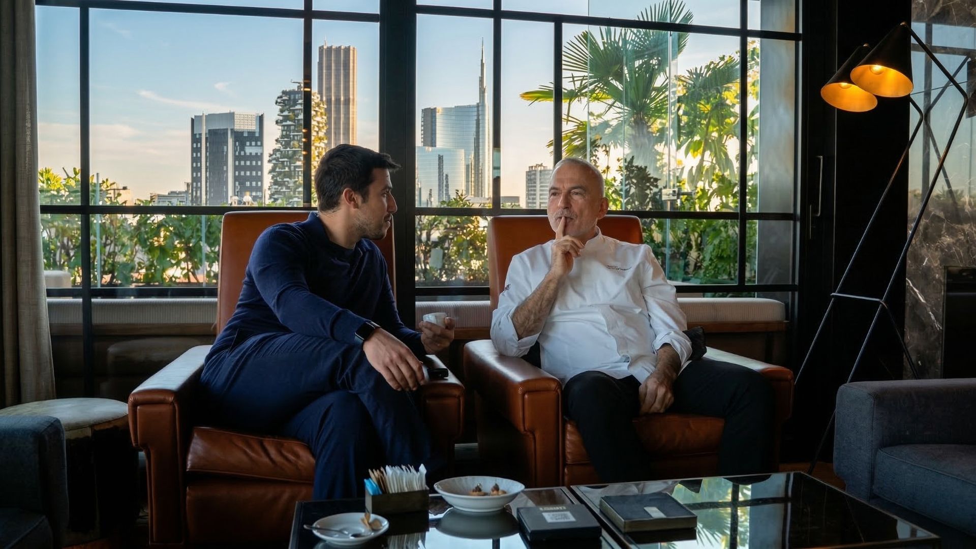 Daniel Ciommiento in conversation with a chef in a luxury restaurant